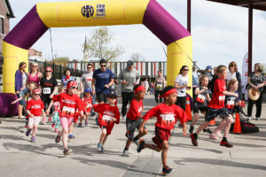 Kids run in red shorts for theKids Kilometer